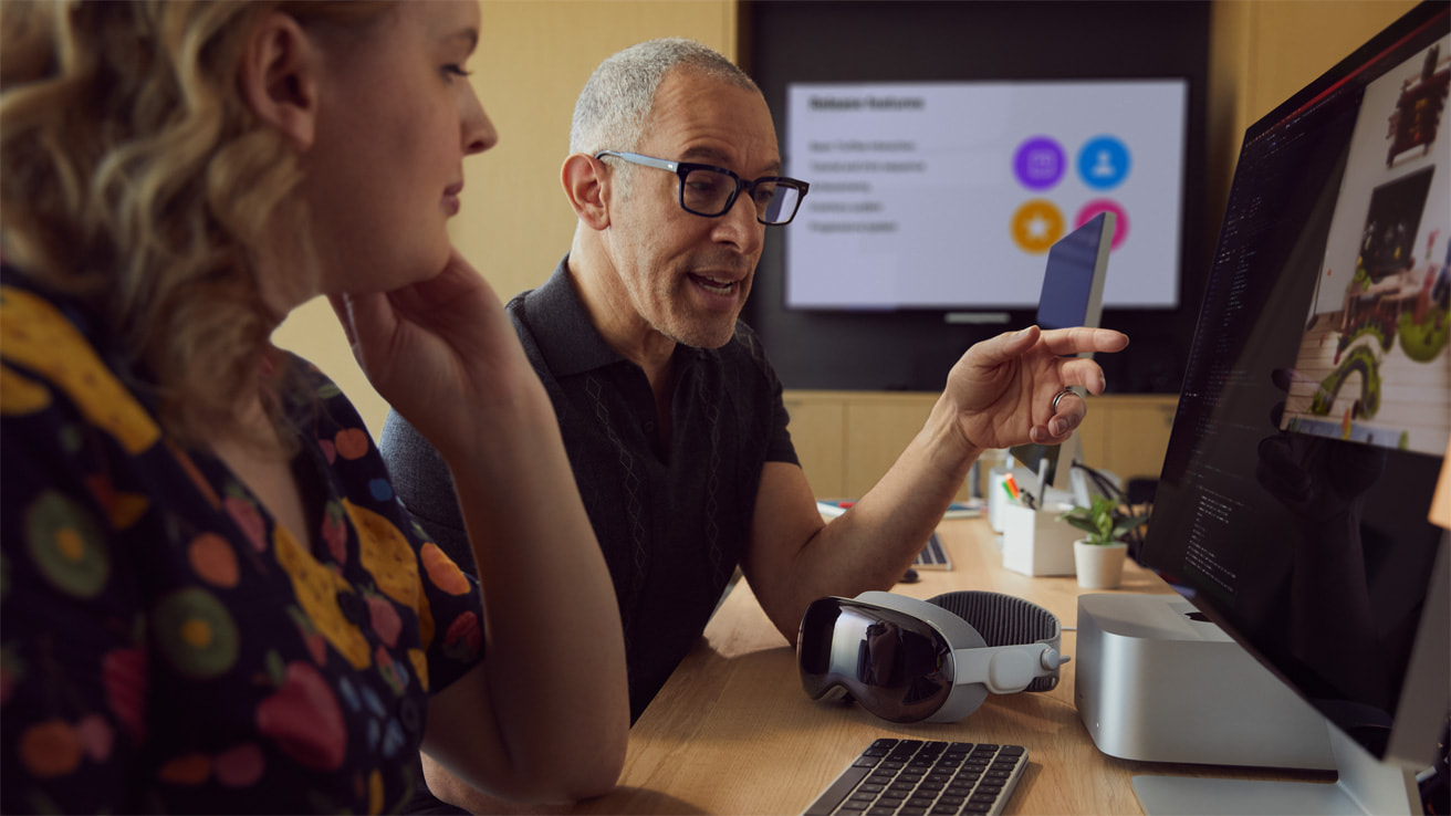 Developer working on Apple Vision Pro apps from Apple Newsroom SDK imagery
